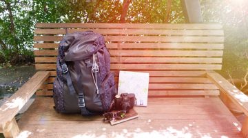 Backpack on a bench - Packing essentials